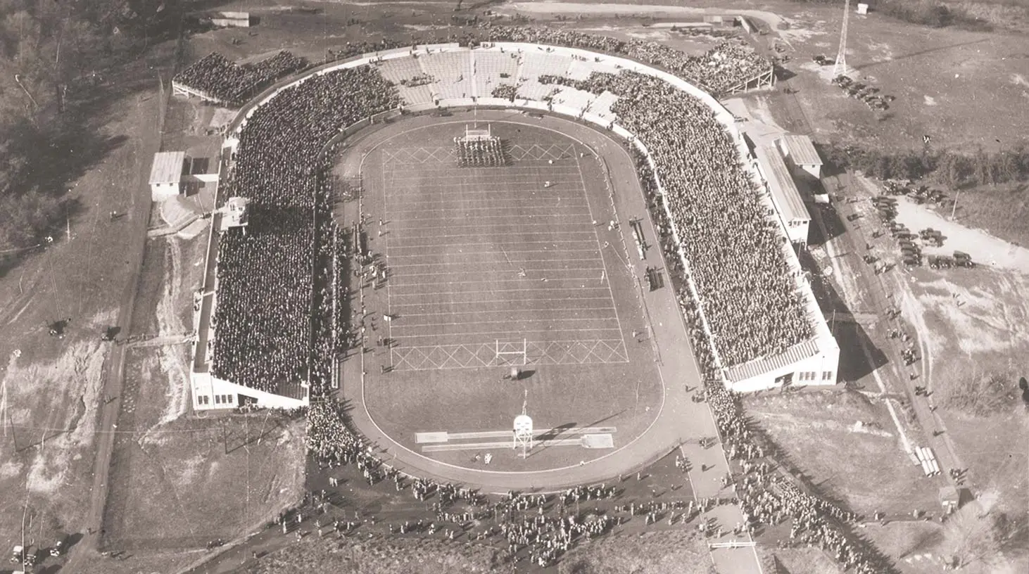 Aerial view of football field with a full stadium