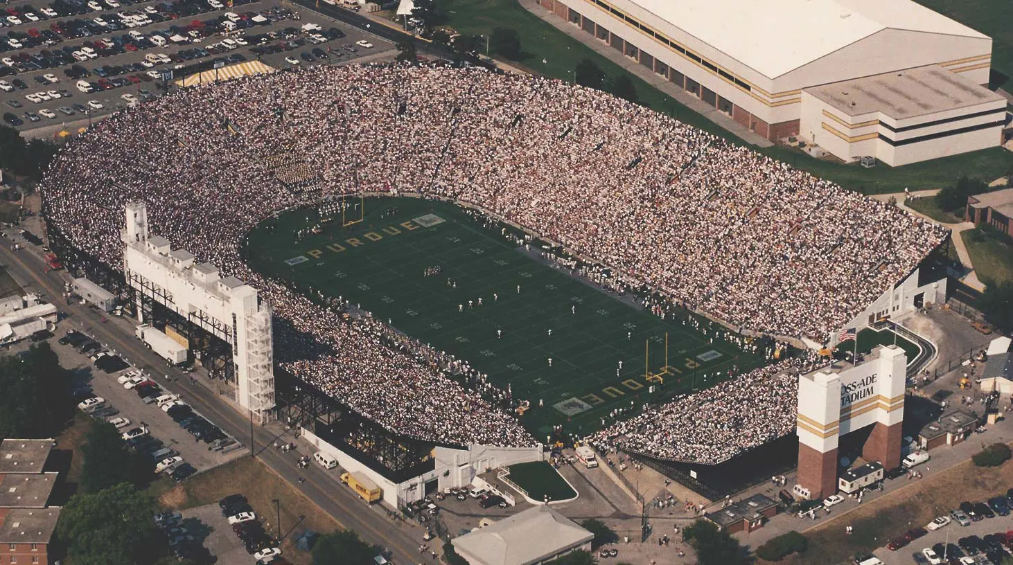 Aerial view of football field with a full stadium